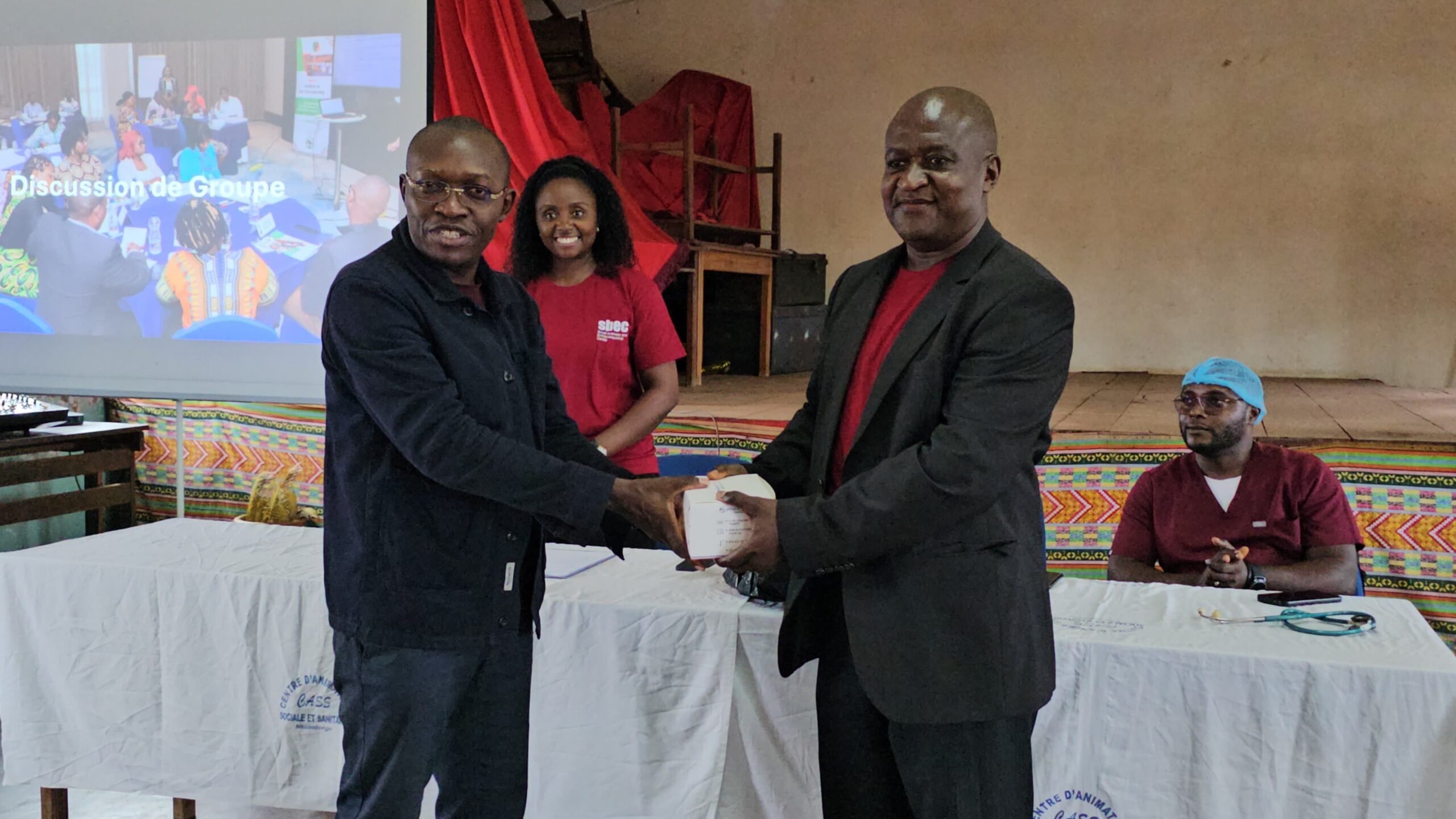 Dr. Constantine Asahngwa Hands Malaria Test Kits to Director of CASS